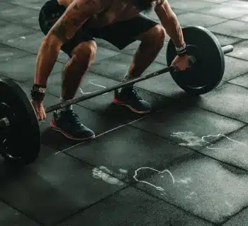 man holding dumbbells